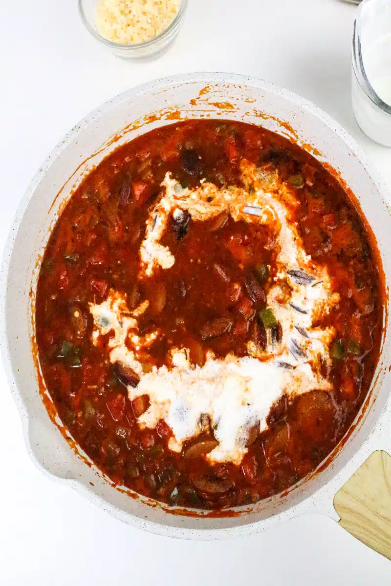 adding heavy cream to the tomato sauce mixture