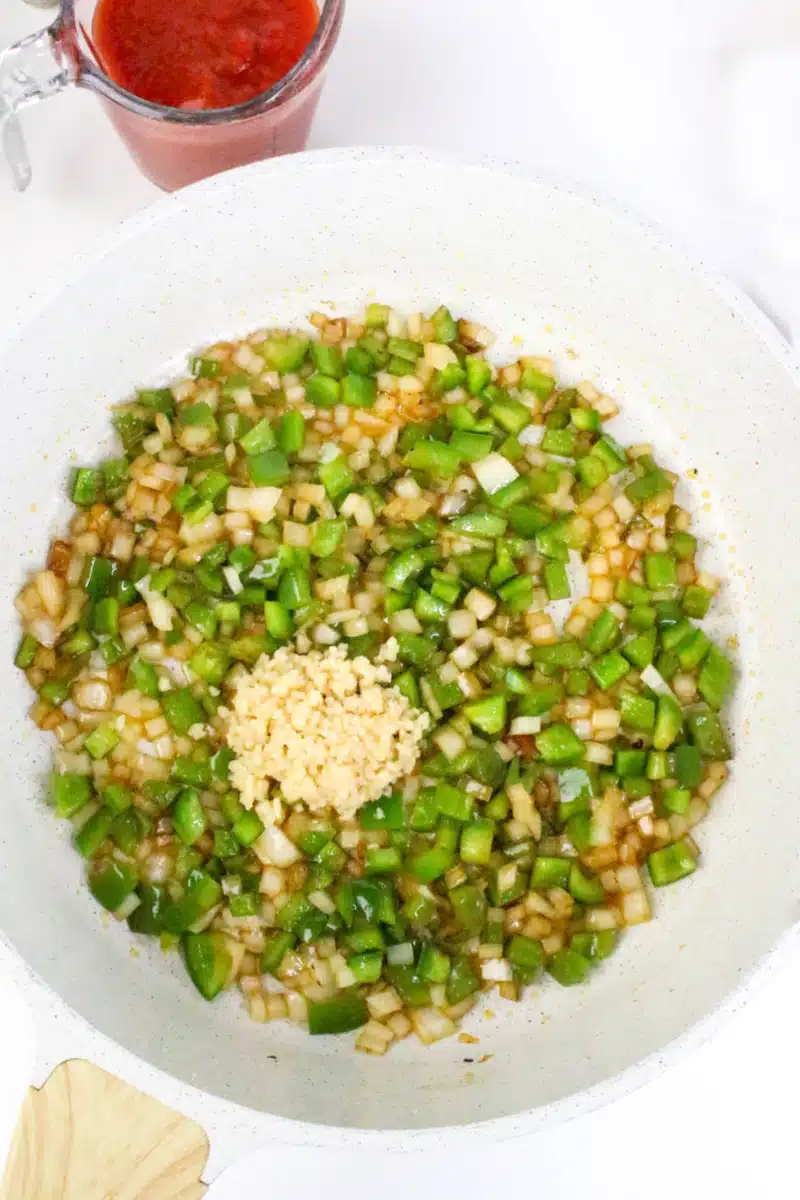 cooking bell pepper, celery, onion and seasonings in a large skillet