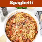 overhead of a pot of creamy cajun sausage and spaghetti with text overlay