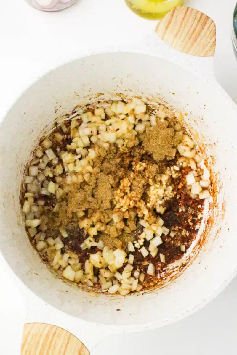 adding ingredients to the pot for pork pozole