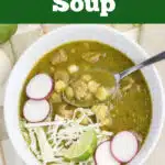 pork pozole soup with toppings and a spoon in a bowl with text overlay