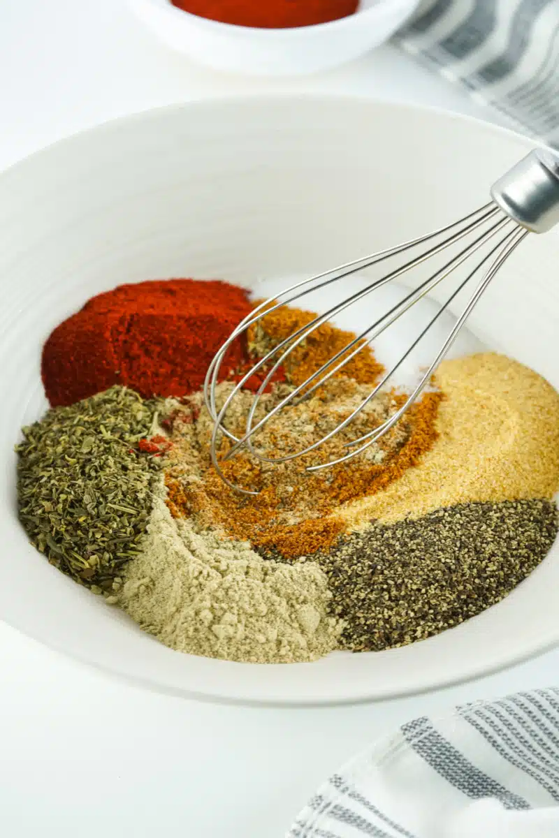 whisking ingredients for Cajun seasoning