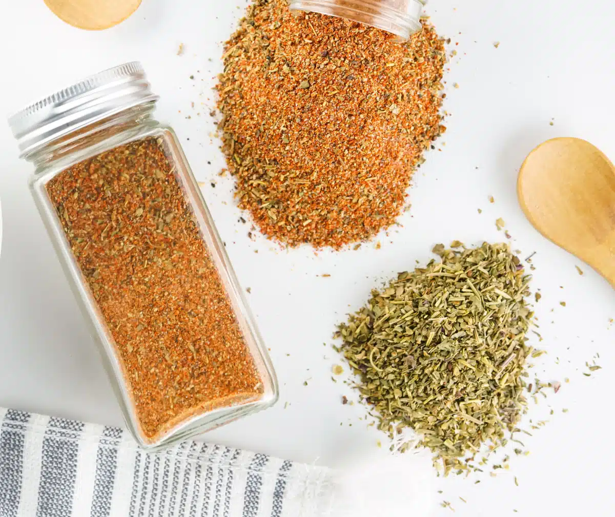 jar od seasoning and piles of spices