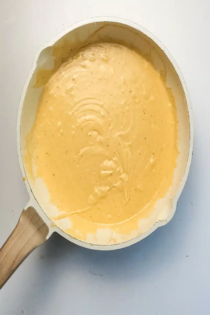 making cheese sauce for macaroni and cheese