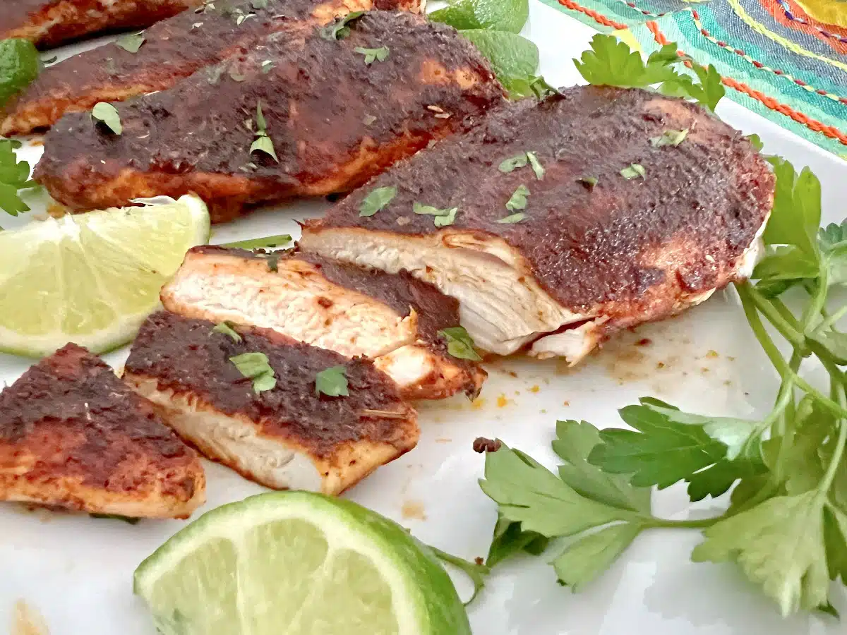 sliced blackened chicken on a platter