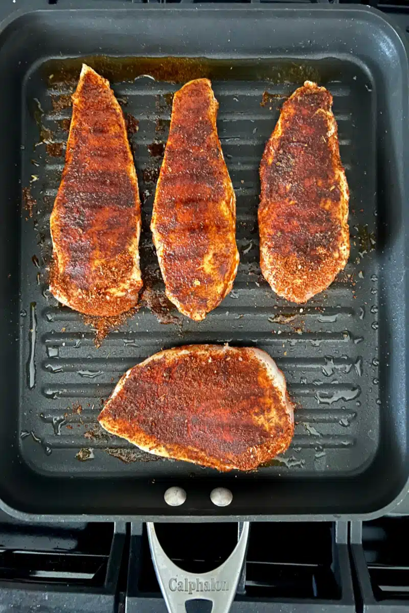 blackened chicken in a grill pan
