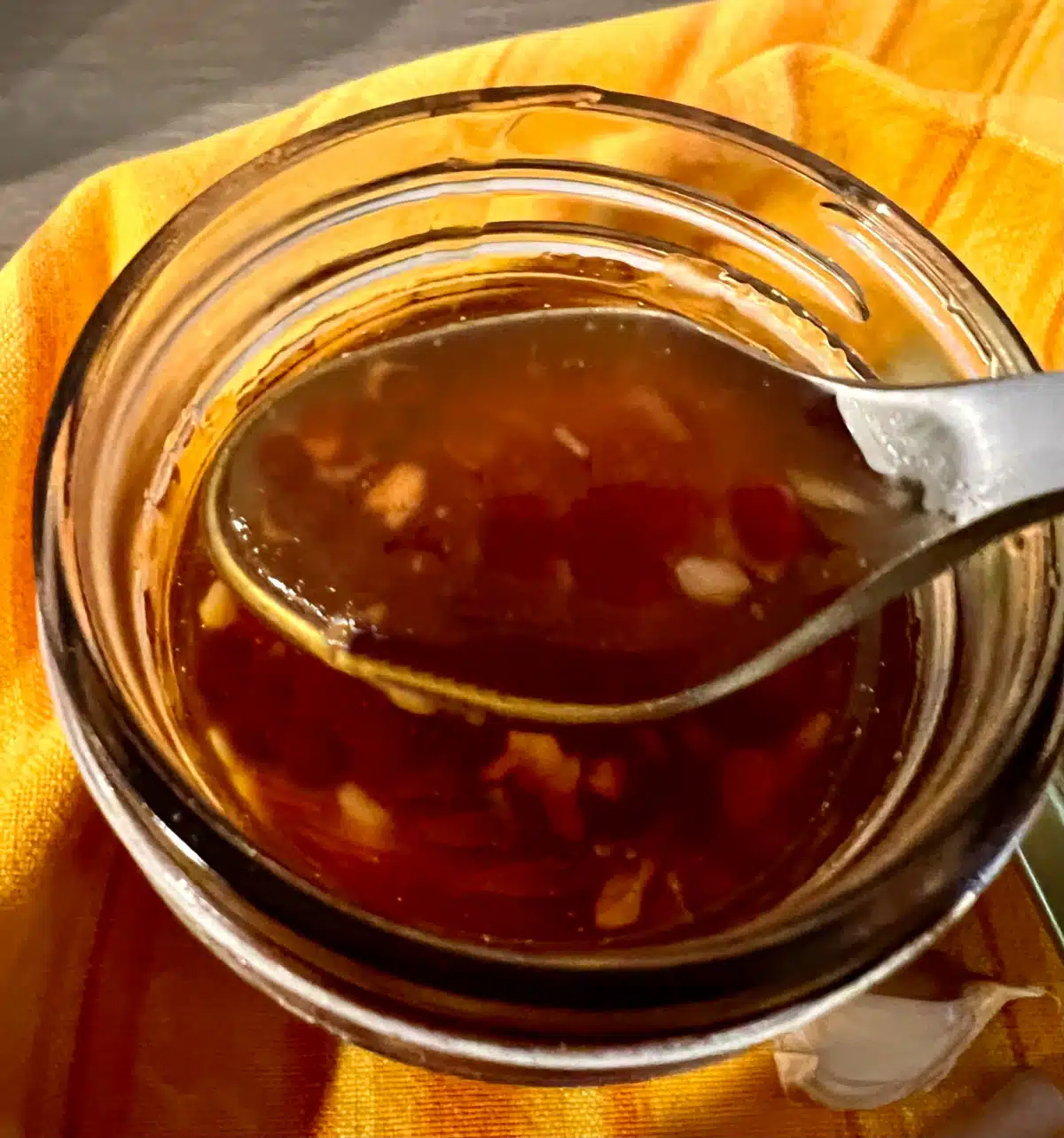 honey garlic sauce on a spoon