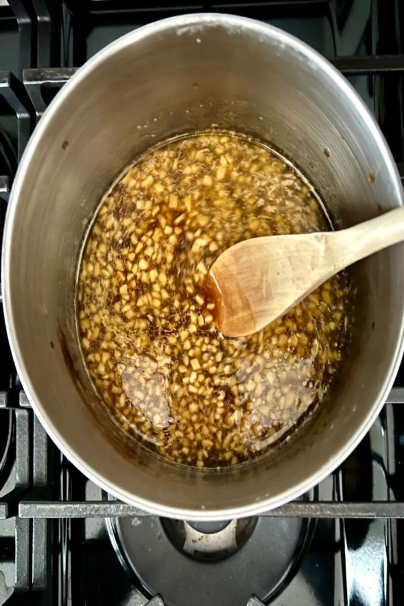 adding honey and brown sugar to the saucepot
