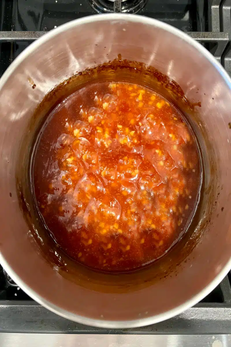 simmering the sauce in the saucepot