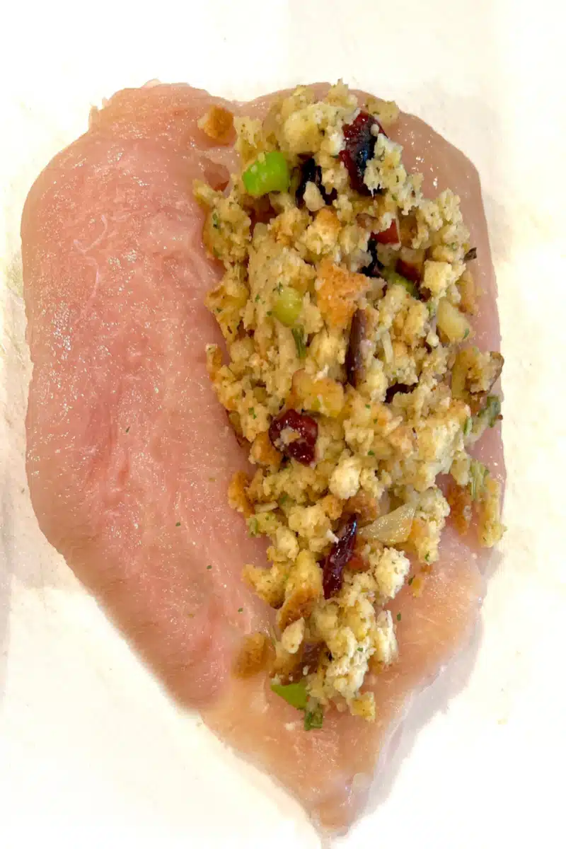 topping chicken breasts with stuffing