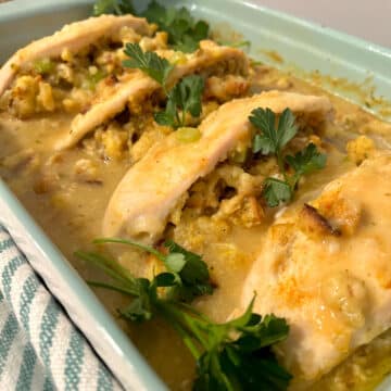 stuffed chicken breast casserole with parsley garnish