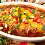 taco meatballs casserole garnished with taco toppings