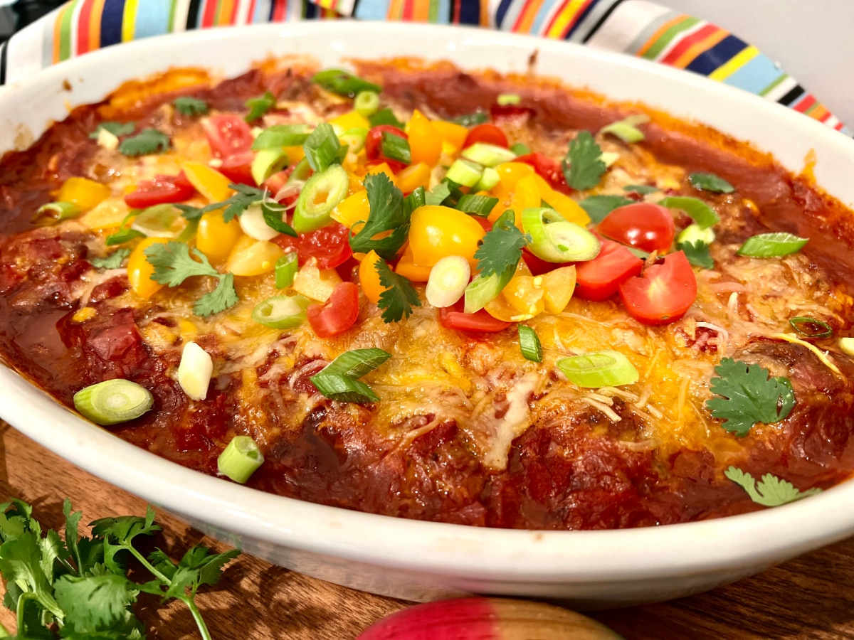 taco meatballs casserole garnished with taco toppings