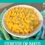 bowl of velveeta mac and cheese on a blue napkin with text overlay