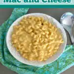 Velveeta mac and cheese in a white serving dish with blue and green napkin and text overlay