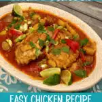 platter of chicken curry with potatoes and blue napkin with text overlay