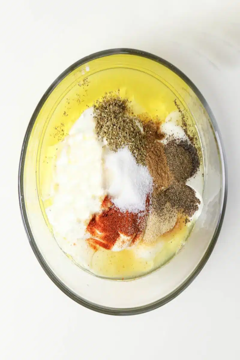 combining marinade ingredients in a bowl
