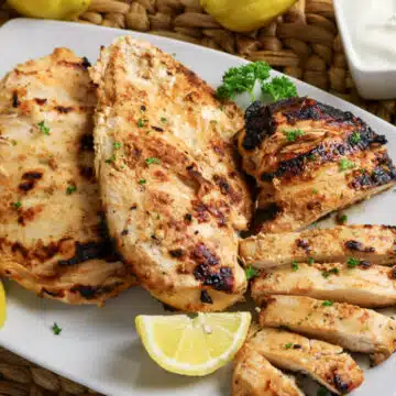 Marinated Greek yogurt chicken on a platter