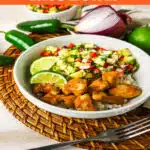pineapple salsa with chicken and rice in a round bowl with text overlay