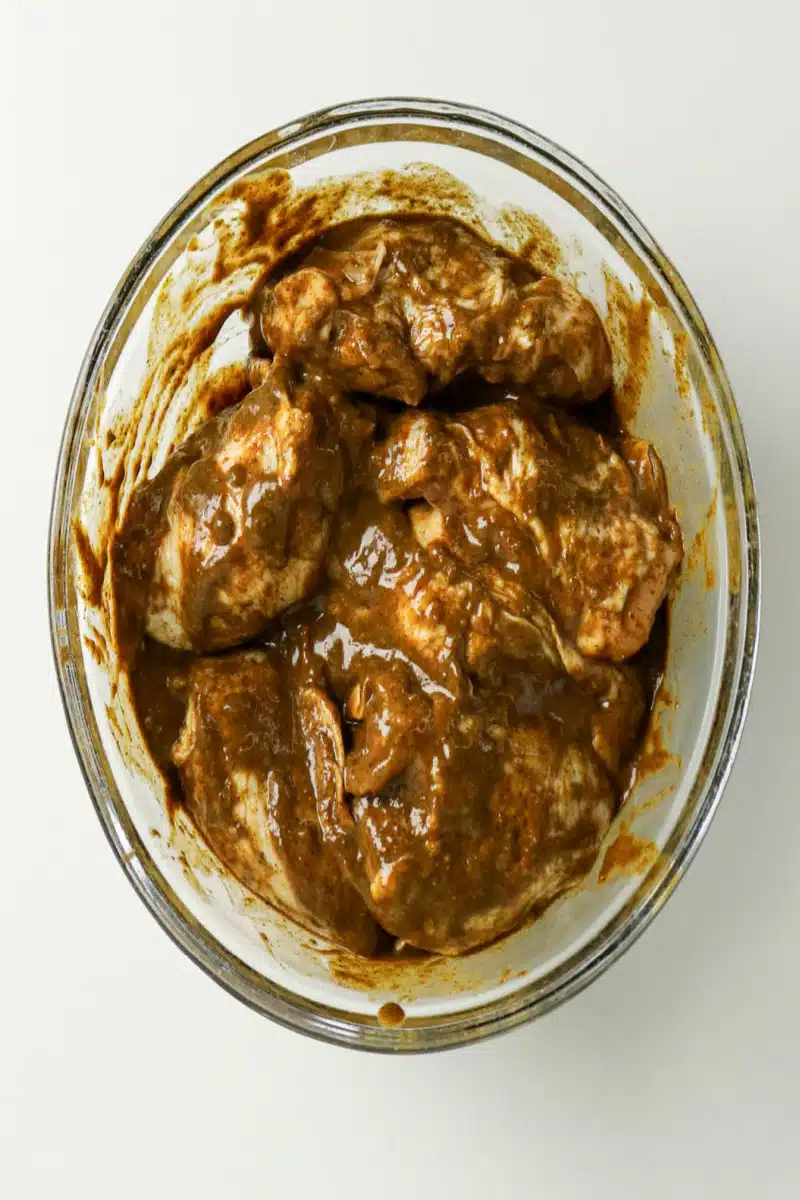marinating chicken pieces in jerk marinade