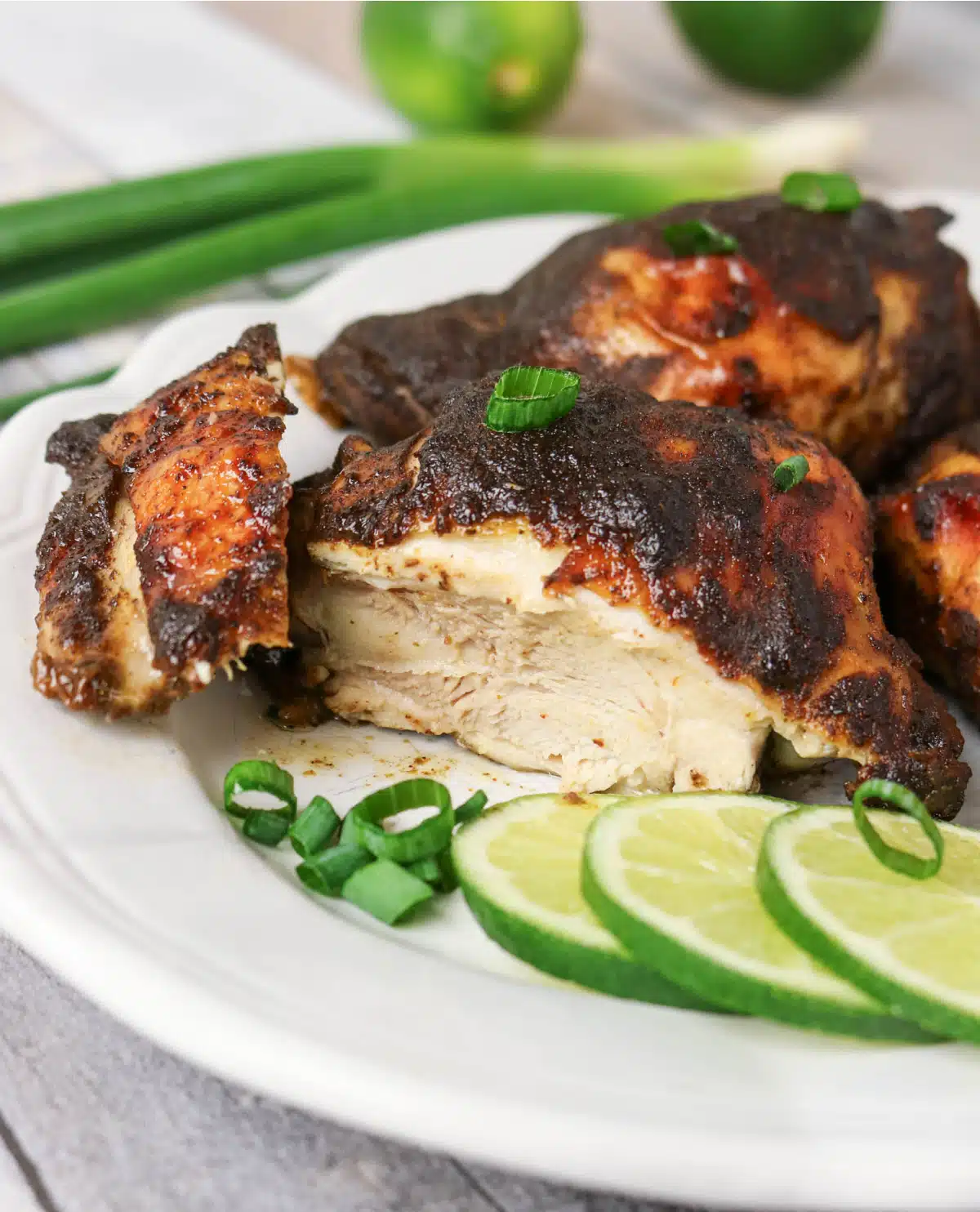 close up of a piece of jerk chicken cut open