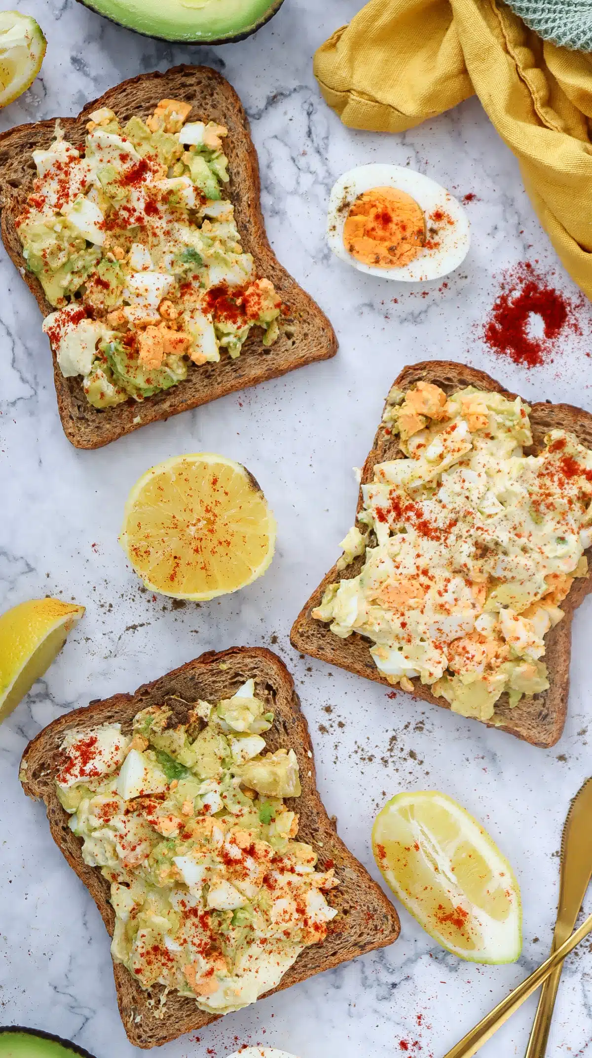 avocado with egg salad on three toasta