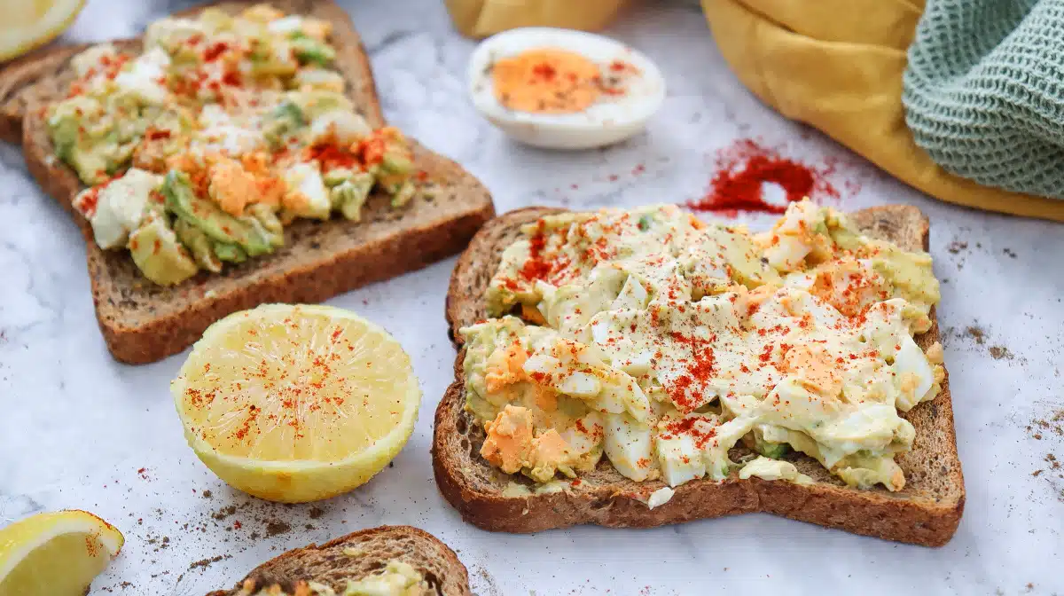 two open faced avocado egg salad sandwiches