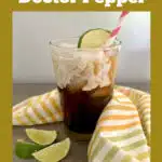 A glass of Dr Pepper Dirty Soda with striped napkin and text overlay