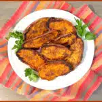cinnamon sugar sweet potatoes on a round dish with text overlay