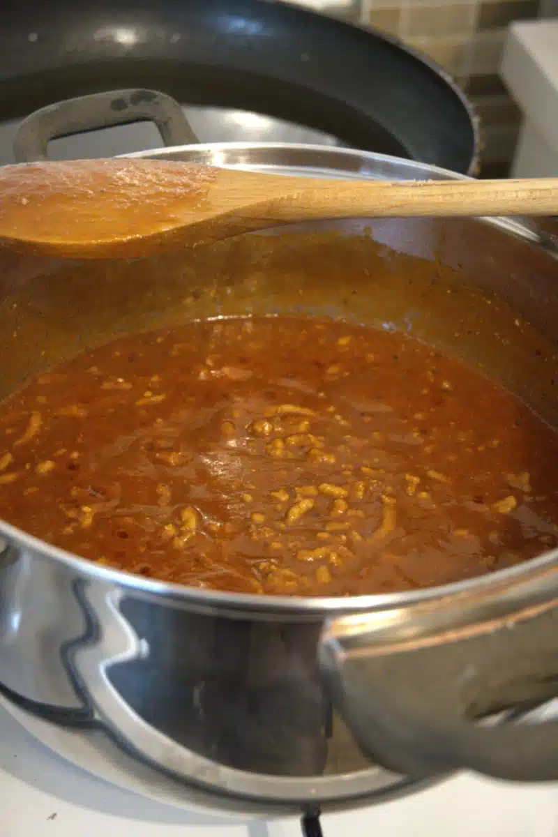 sauce in a pot with a wooden spoon
