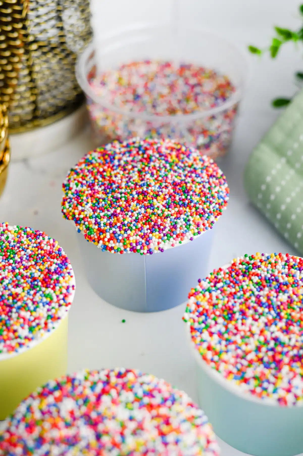 dot cakes with container of sprinkles