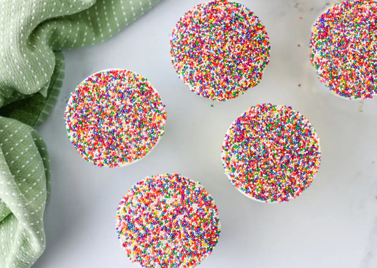 overhead of five dot cakes with pretty napkin