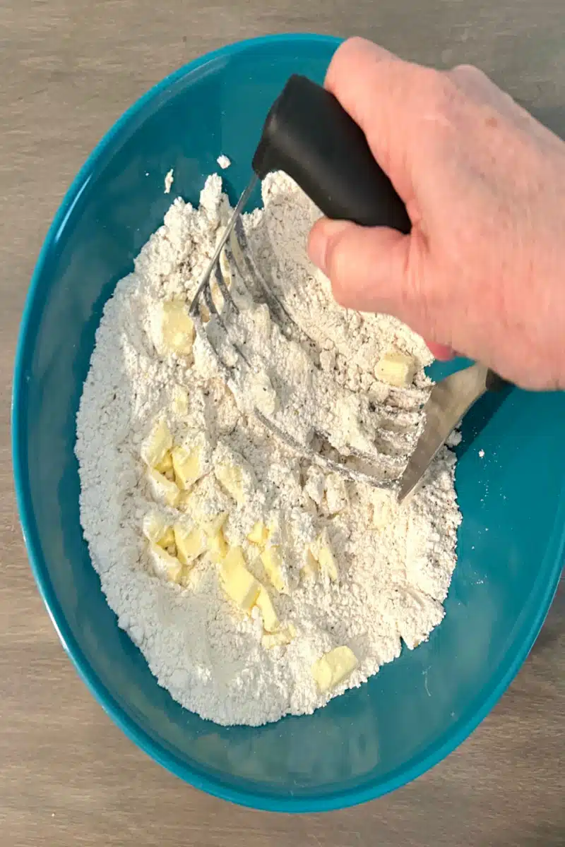 cutting butter into biscuit mix with a pastry cutter