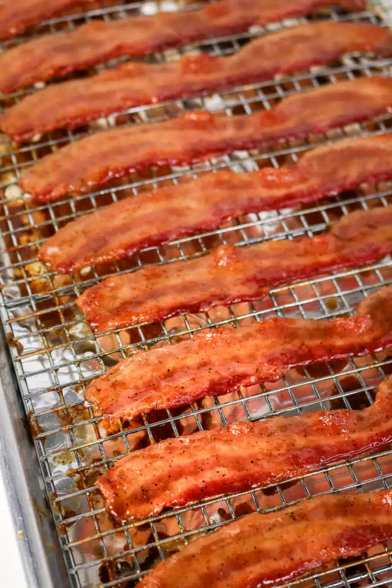 cooked maple glazed bacon on a wire rack