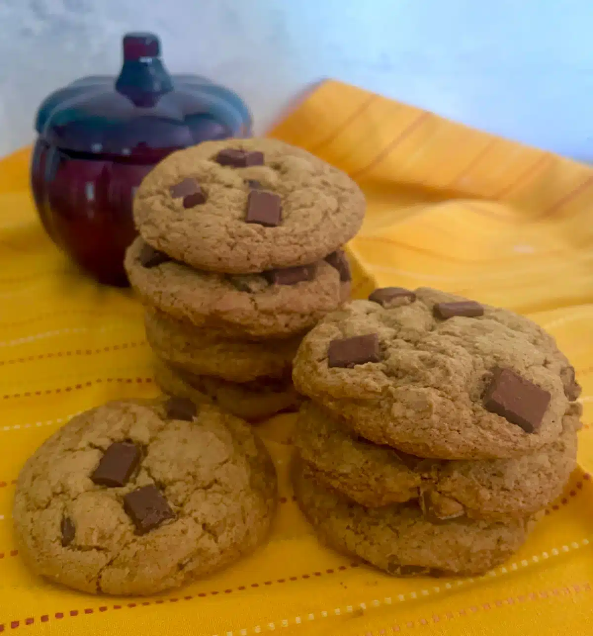 pumpkin chocolate chunk cookies with glass pumpkin and pretty napkin