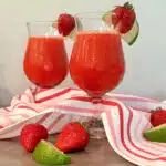 two glasses of strawberry daiquiris with pretty napkin