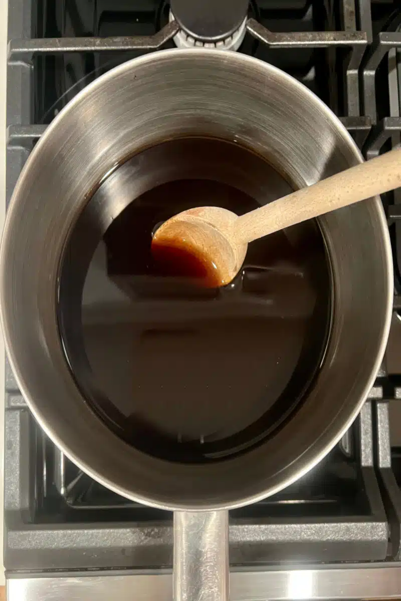 combining ingredients in a saucepot for sweet and sour sauce