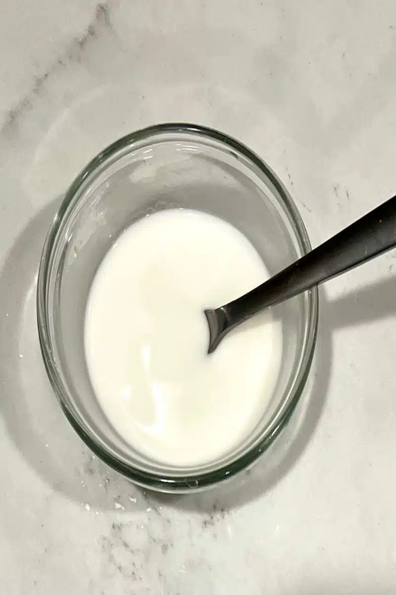 making a cornstarch slurry in a small bowl