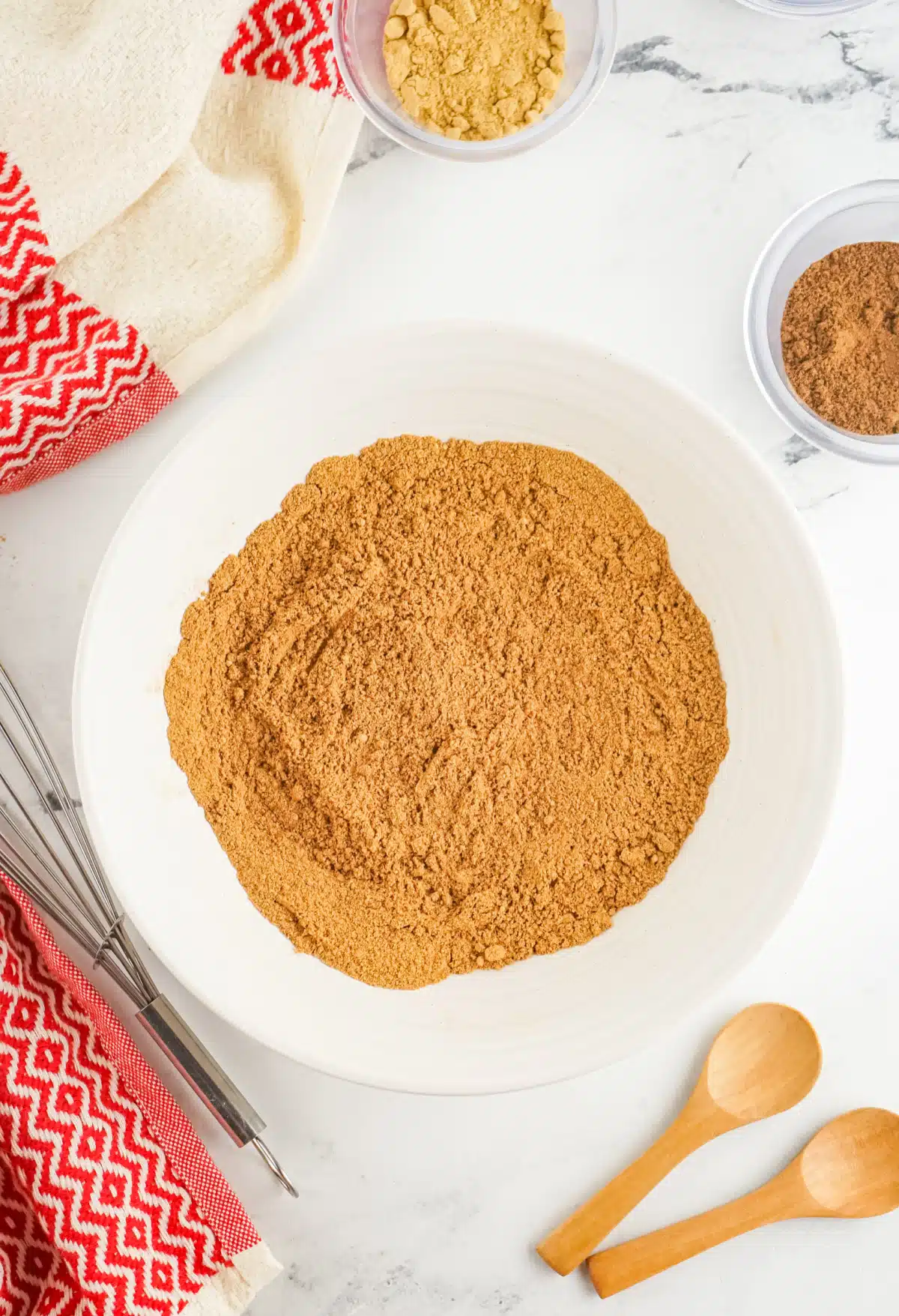 overhead photo of gingerbread spice in a white bowl