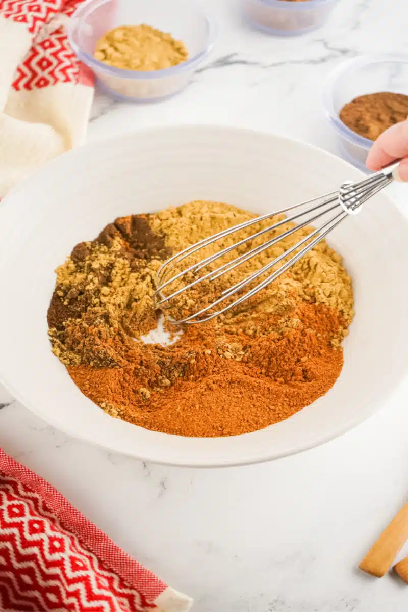 whisking spices together to make gingerbread spice mix