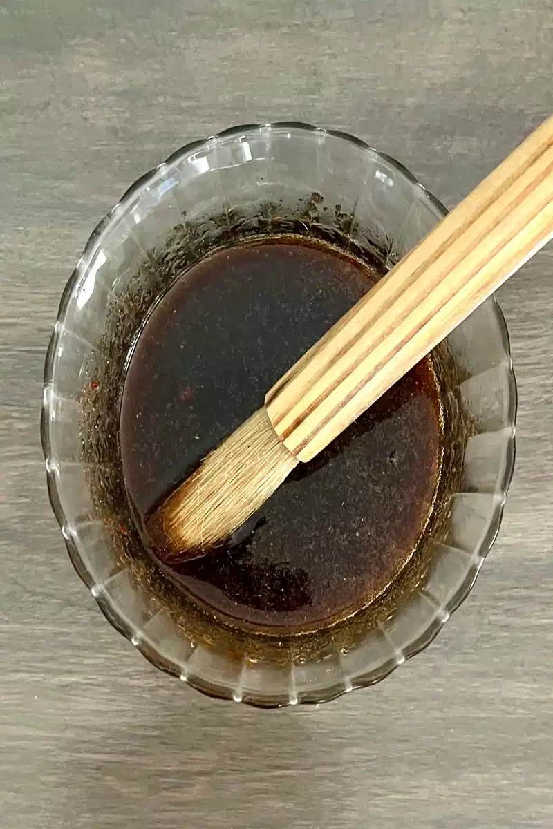 combining ingredients in a bowl for a maple glaze