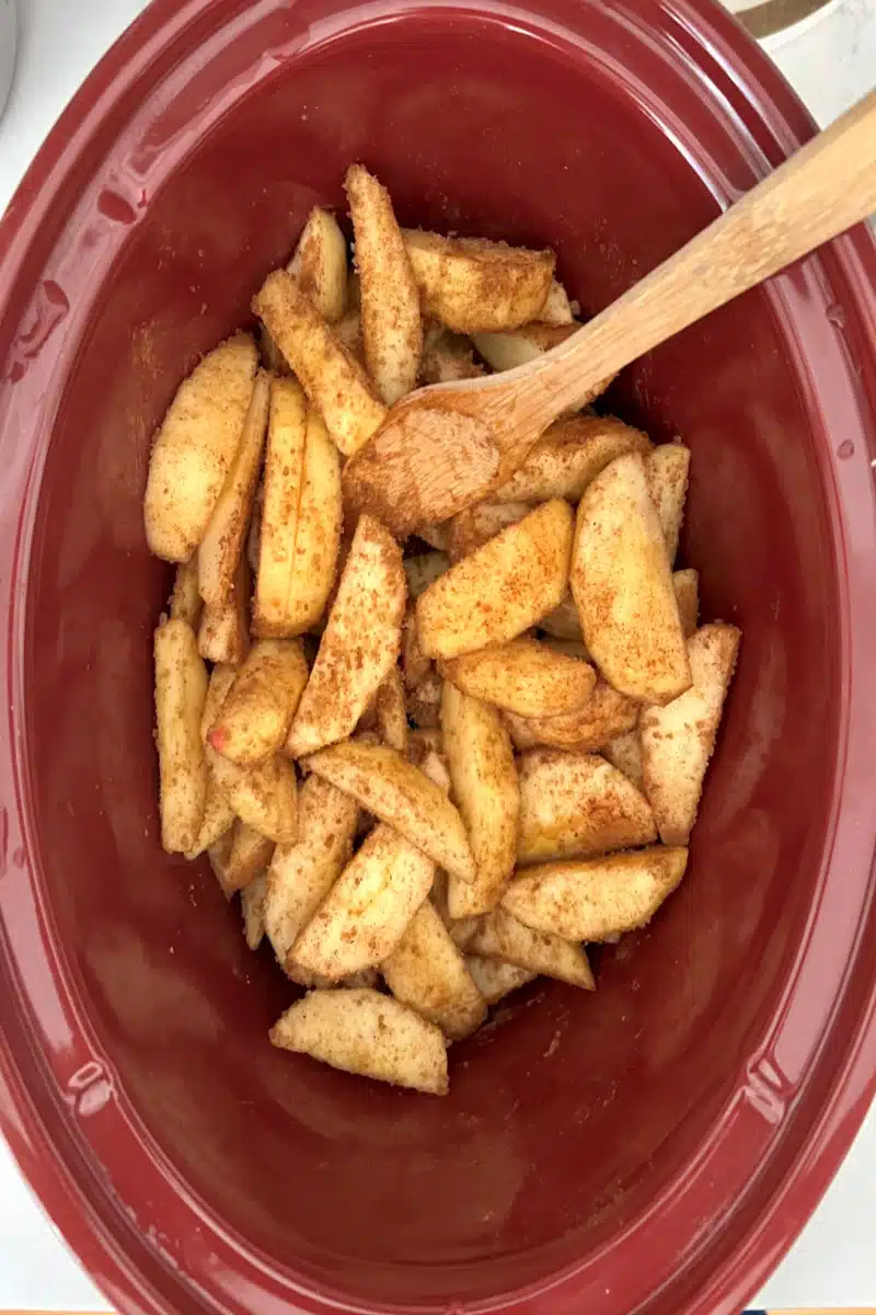 tossing apples with brown sugar and spices until evenly coated