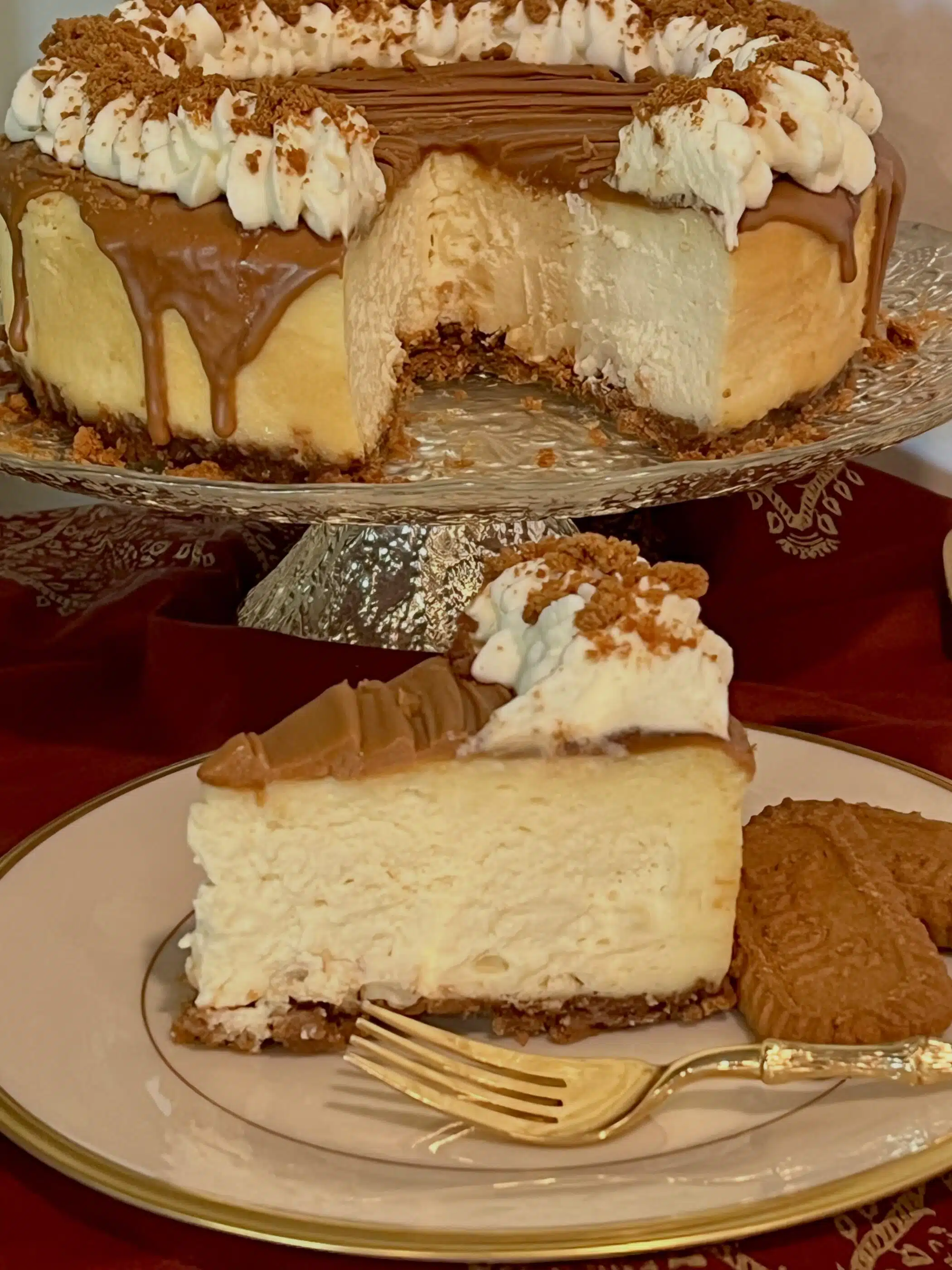 slice of Biscoff cheesecake on a serving plate with a fork