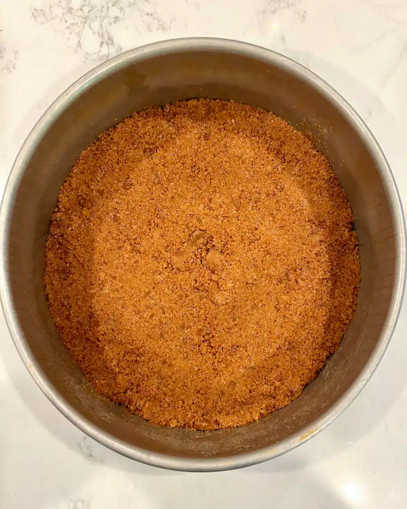 Biscoff cookie crust in a springform pan